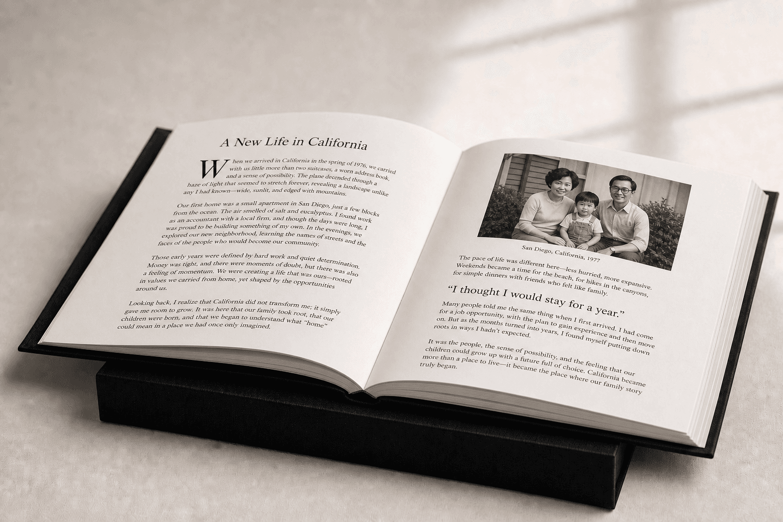 Book design preview: a family photograph and story printed across an open Omoide biography.